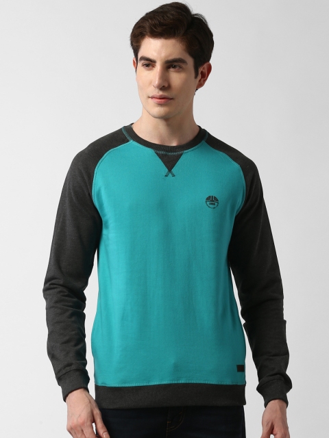 

Peter England Casuals Men Blue & Black Solid Sweatshirt