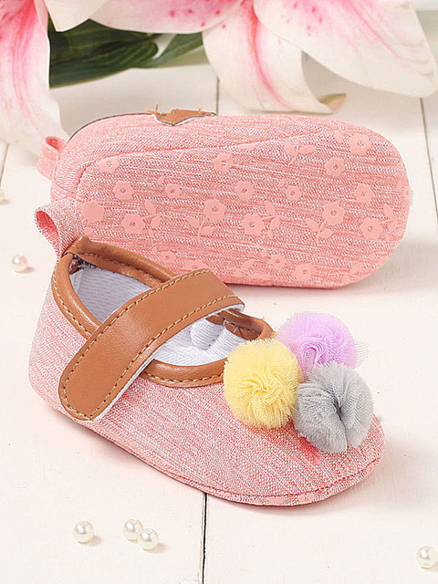 

Walktrendy Infant Girls Peach-Coloured Pom Pom Applique Booties