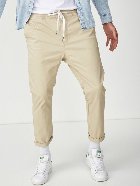 

COTTON ON Men Beige Loose Fit Solid Regular Trousers