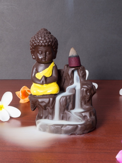 

Golden Peacock Yellow & Black Buddha Smoke Fountain Showpiece