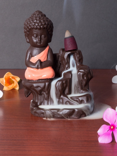 

Golden Peacock Red & Black Buddha Smoke Fountain Showpiece