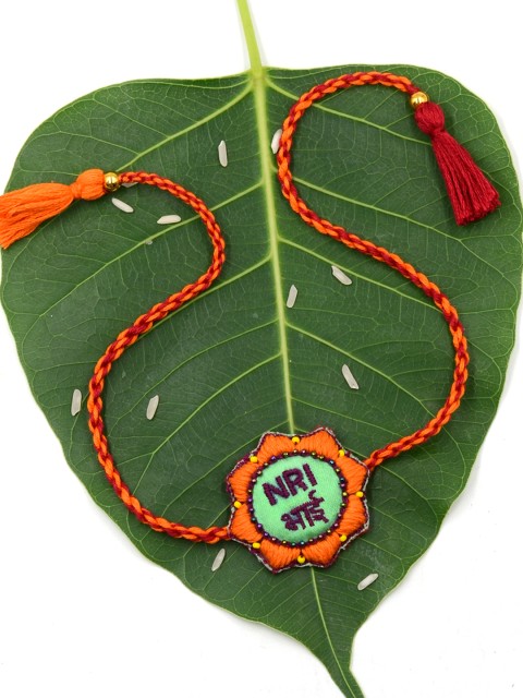 

Krafted with Happiness Orange & Green NRI Bhai Hand Embroidered Rakhi