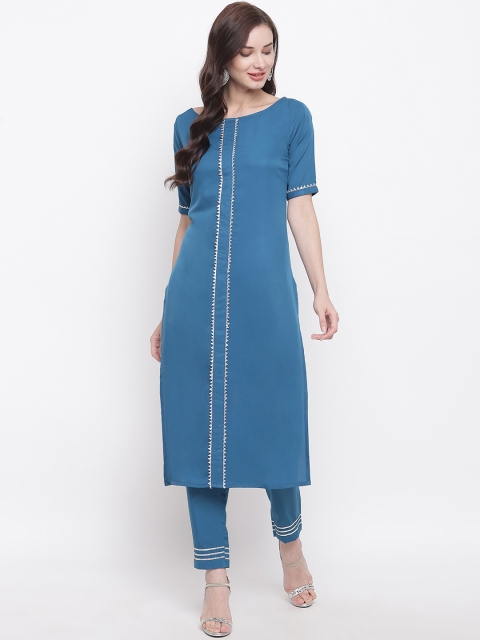 

FABNEST Women Blue & Silver-Toned Solid Kurta with Trousers
