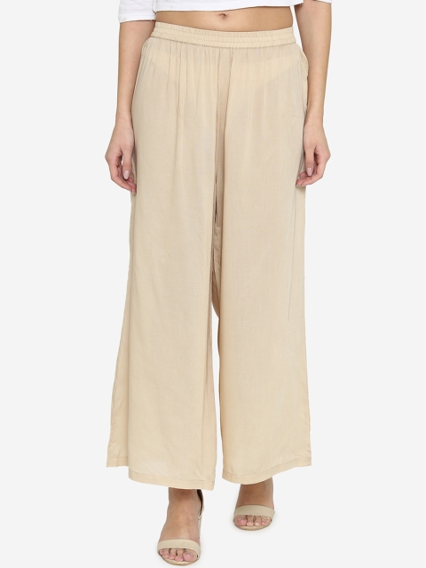 

Laabha Women Beige Solid Flared Palazzos