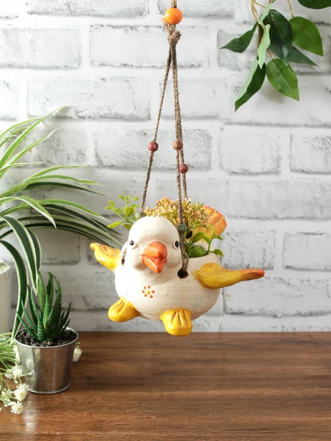 

Aapno Rajasthan White & Yellow Handcrafted Terracotta Flying Bird Beaded Hanging Planter