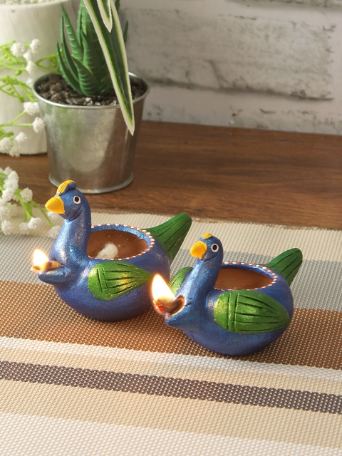 

Aapno Rajasthan Set Of 2 Blue & Green Designer Handcrafted Terracotta Peacock Diyas