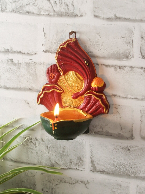 

Aapno Rajasthan Red & Green Handcrafted Terracotta Hanging Ganapati Deepak