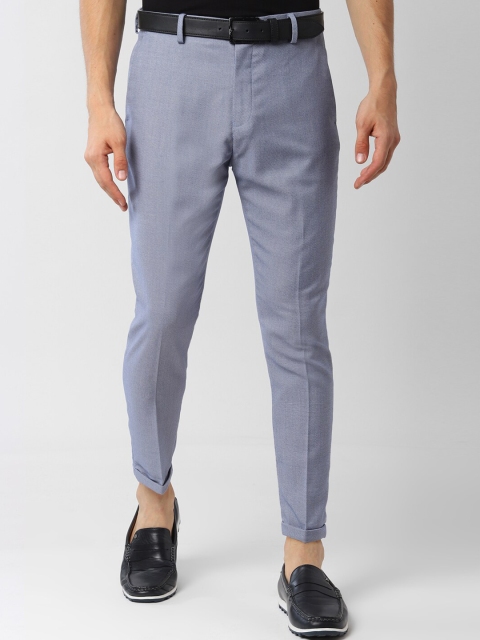 

Peter England Men Blue Tapered Fit Self Design Regular Trousers