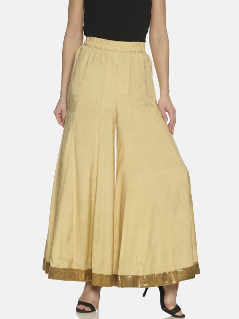 

Saffron Threads Women Beige Solid Flared Palazzos