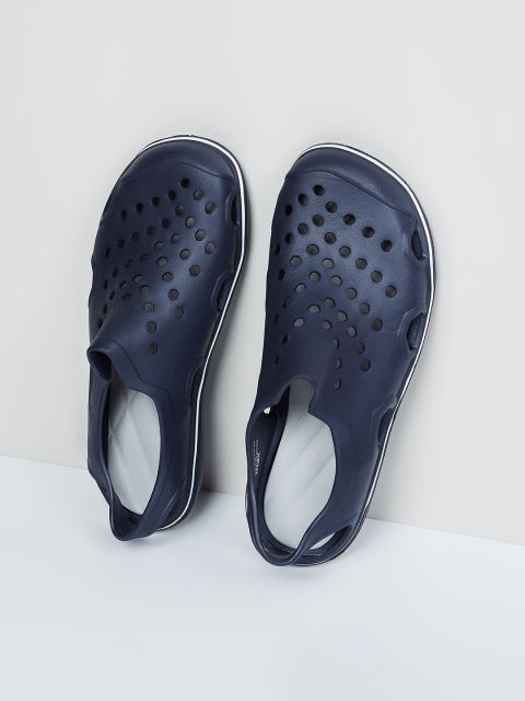 

max Men Navy Blue Self Design Clogs