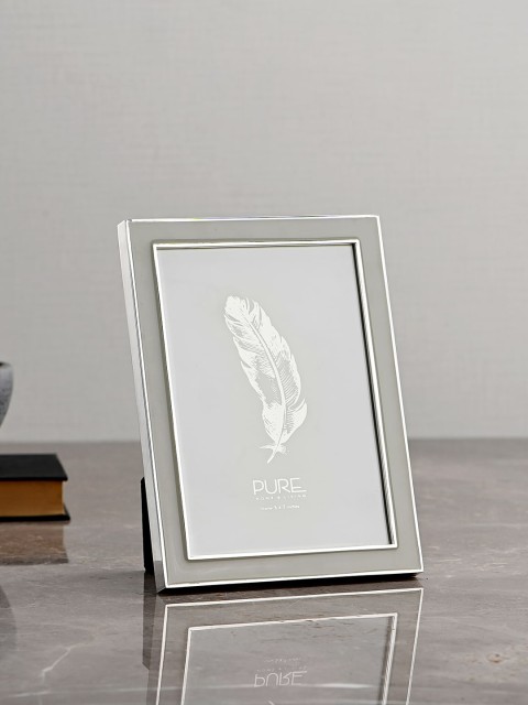 

Pure Home and Living Silver-Toned & Beige Solid Shiny Enamel Photo Frame