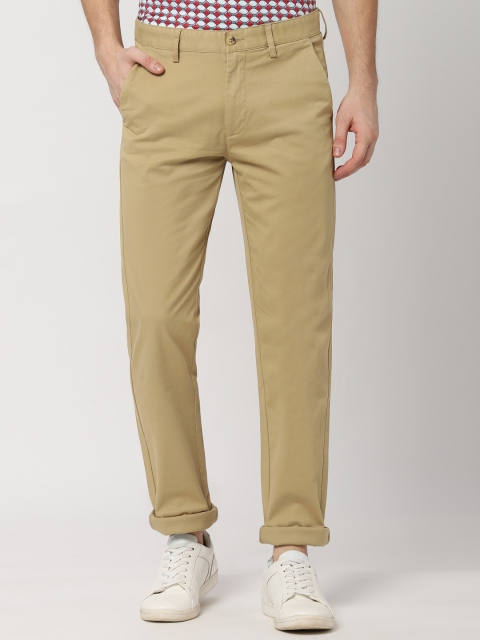 

Peter England Men Beige Slim Fit Solid Regular Trousers