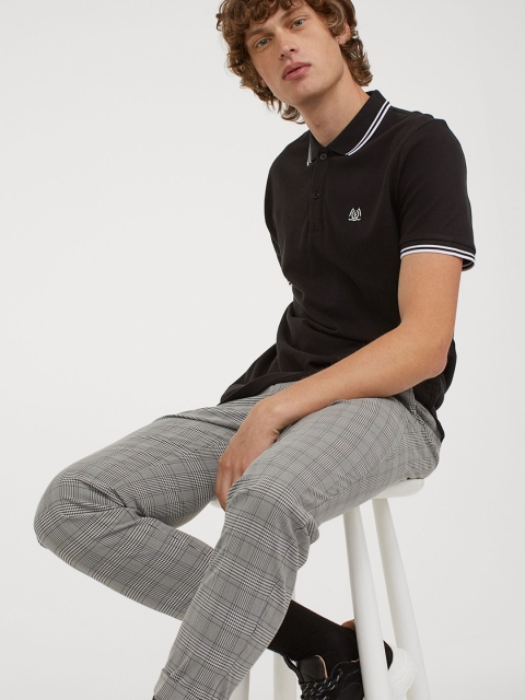 

H&M Men Black Solid Polo shirt