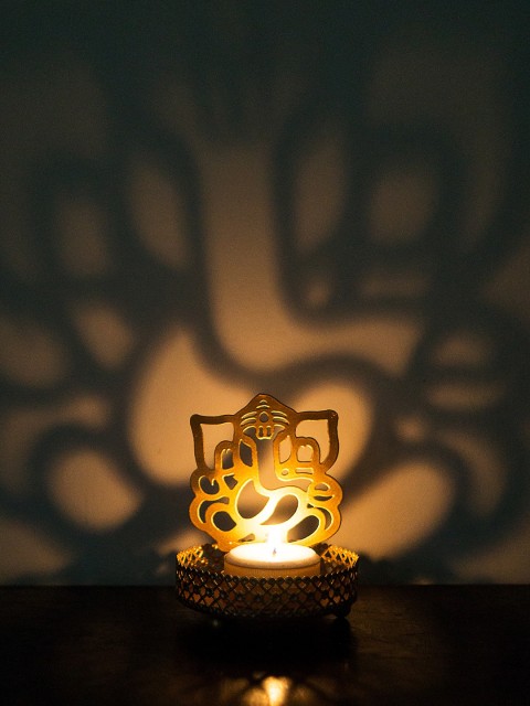 

Golden Peacock Gold Lord Ganesha Tea Light Candle Holder
