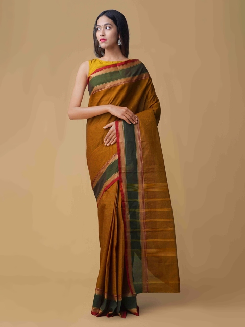 

Unnati Silks Mustard Solid Pure Cotton Saree