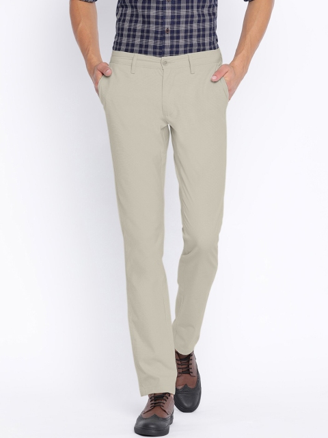

Basics Men Beige Tapered Fit Solid Regular Trousers