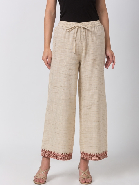 

Ethnicity Women Beige Solid Wide Leg Palazzos