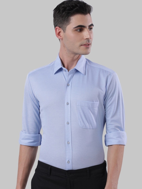 

Raymond Men Blue Regular Fit Solid Semiformal Shirt