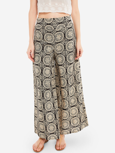 

Desi Weavess Women Black & Off-White Ethnic Motifs Printed Flared Palazzos