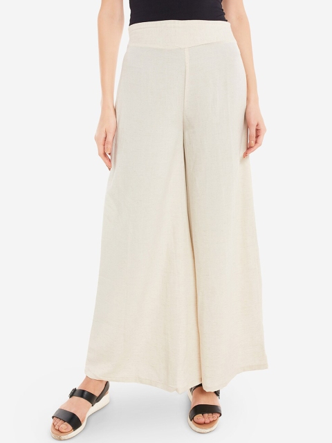 

Desi Weavess Women Off White Solid Flared Fit Palazzos