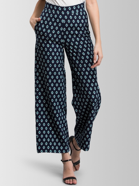 

FableStreet Women Navy Blue Flared Printed Parallel Trousers