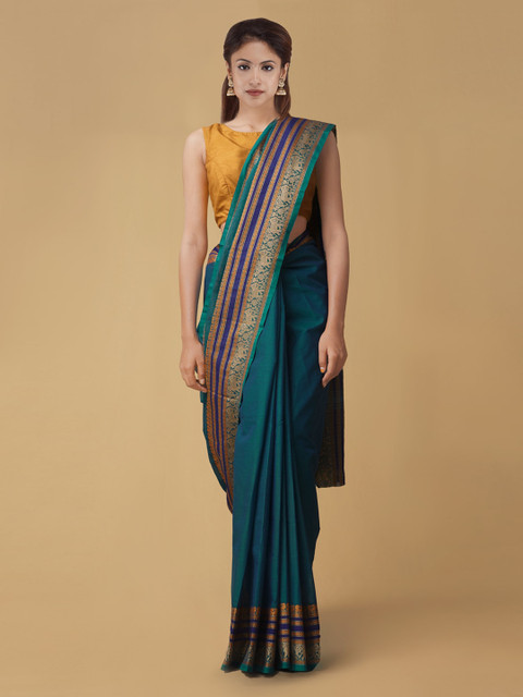 

Unnati Silks Green Pure Cotton Solid Kanjeevaram Saree
