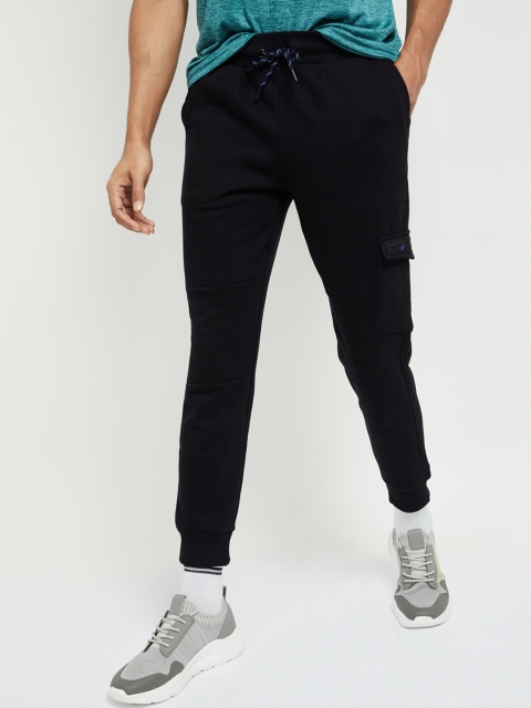 

max Men Black Solid Slim-Fit Joggers