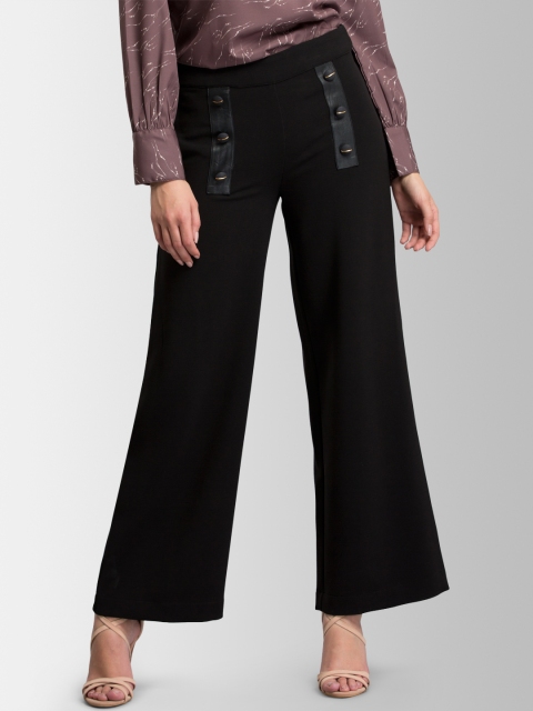 

FableStreet Women Black Flared Solid Parallel Trousers