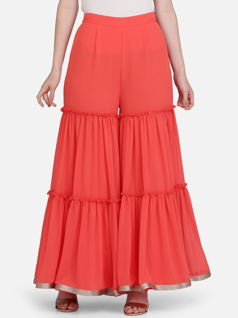 

Ojjasvi Women Coral Solid Sharara