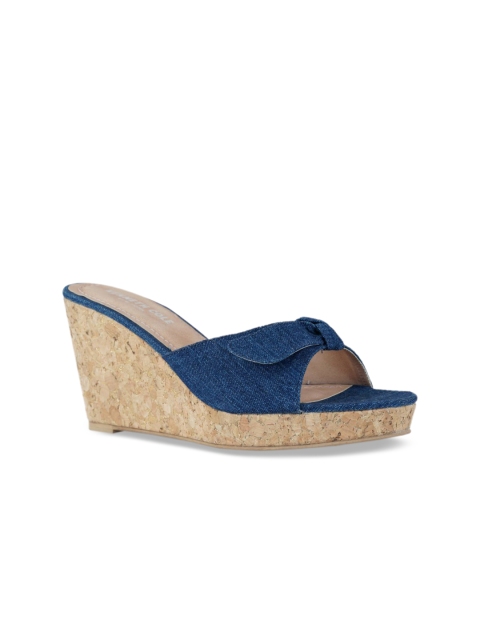 

Kenneth Cole Women Blue Solid Leather Wedges