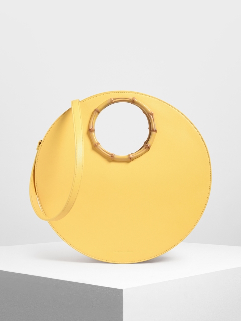 

CHARLES & KEITH Yellow Solid Handheld Bag
