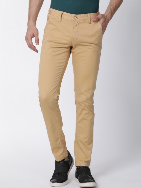 

Mucho Solo Men Beige Skinny Fit Solid Regular Trousers