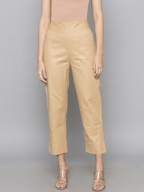

Desi Weavess Women Beige Regular Fit Solid Regular Trousers