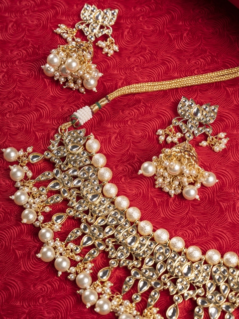 

Shoshaa Gold-Plated White Kundan & Pearl Embedded Jewellery Set