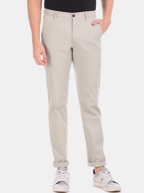 

Arrow Men Beige Solid Regular Trousers