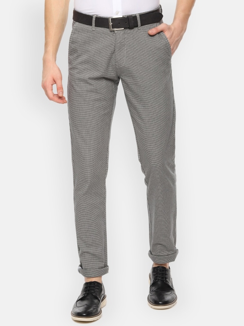 

Van Heusen Sport Men White & Black Slim Fit Self Design Regular Trousers