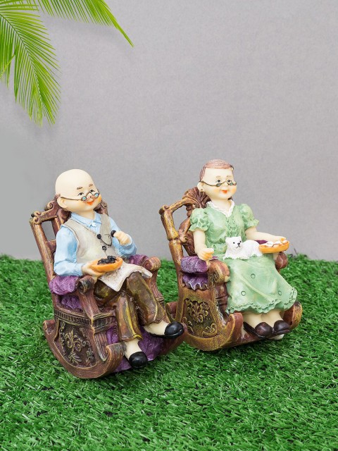

Golden Peacock Set Of 2 Brown & Green Old Couple Sitting On Chair Polyresin Showpiece