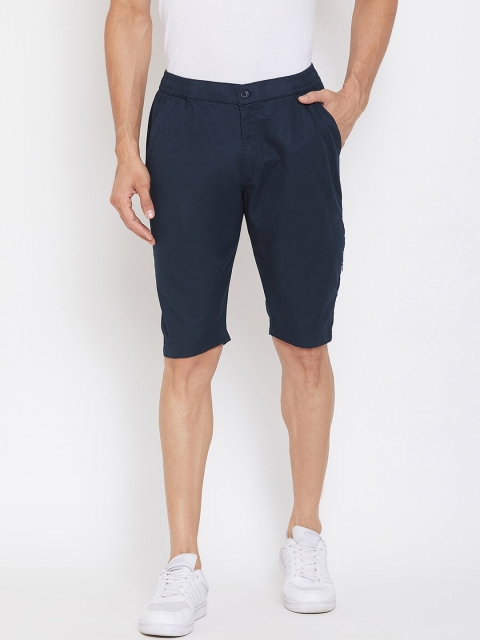 

Okane Men Navy Blue Solid Regular Fit Shorts