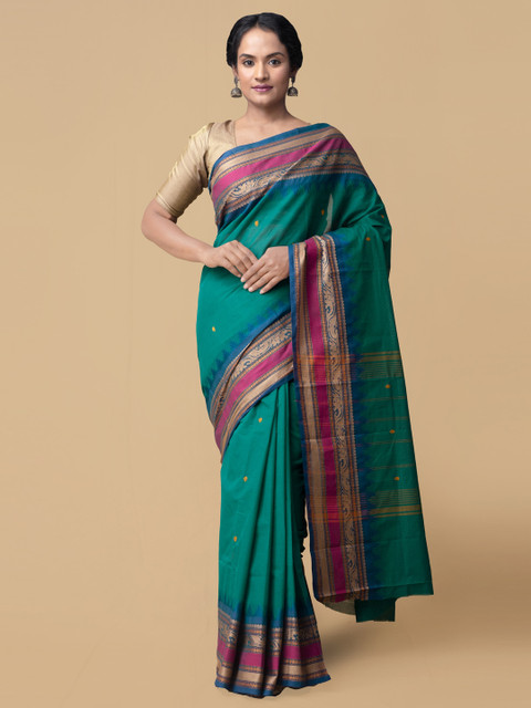 

Unnati Silks Green Pure Cotton Solid Kanjeevaram Saree