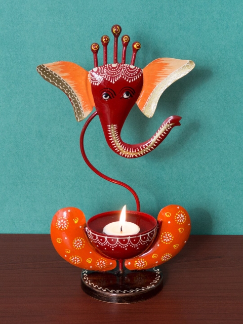 

Golden Peacock Maroon & Orange Iron Ganesha T-Light Candle Stand