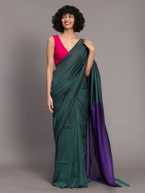 

Suta Green & Violet Cotton Blend Solid Acrylic Saree
