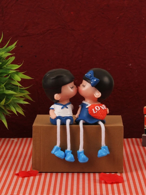 

TIED RIBBONS Blue & Red Couple Show Piece