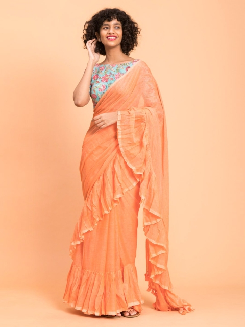 

Suta Peach Solid Pure Cotton Ruffle Saree