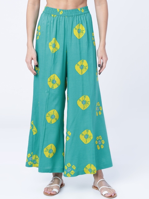 

Vishudh Women Turquoise Blue & Yellow Printed Straight Palazzos