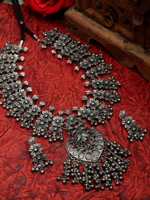 

Moedbuille Ghungroo Studded Floral & Tasselled Design Oxidised Silver Plated Tribal Jewelry Set