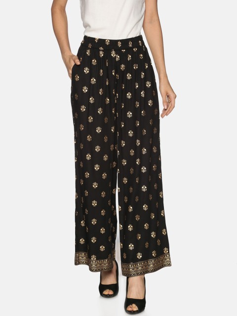 

Saffron Threads Women Black & Gold-Toned Printed Flared Palazzos