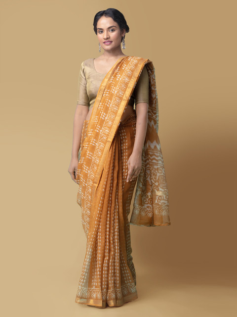 

Unnati Silks Orange Pure Cotton Dabu Printed Kota Saree