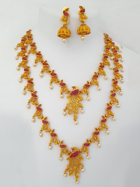 

Alankruthi Pink Gold-Plated Stone-Studded & Beaded Peacock Shaped Jewellery Set