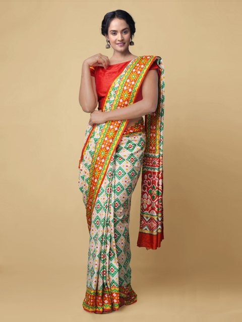 

Unnati Silks White & Green Pure Crepe Printed Patola Handloom Saree