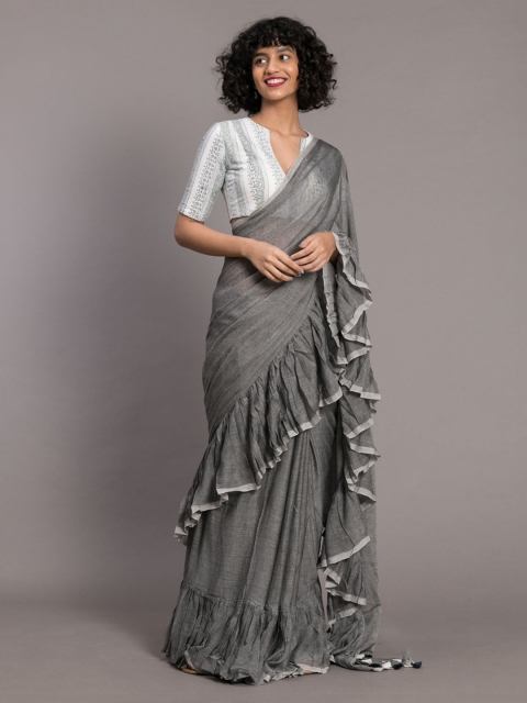 

Suta Grey Solid Pure Cotton Ruffle Saree